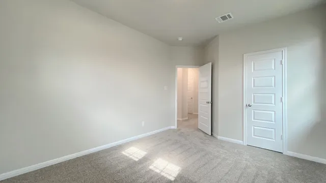 an empty room with closet area
