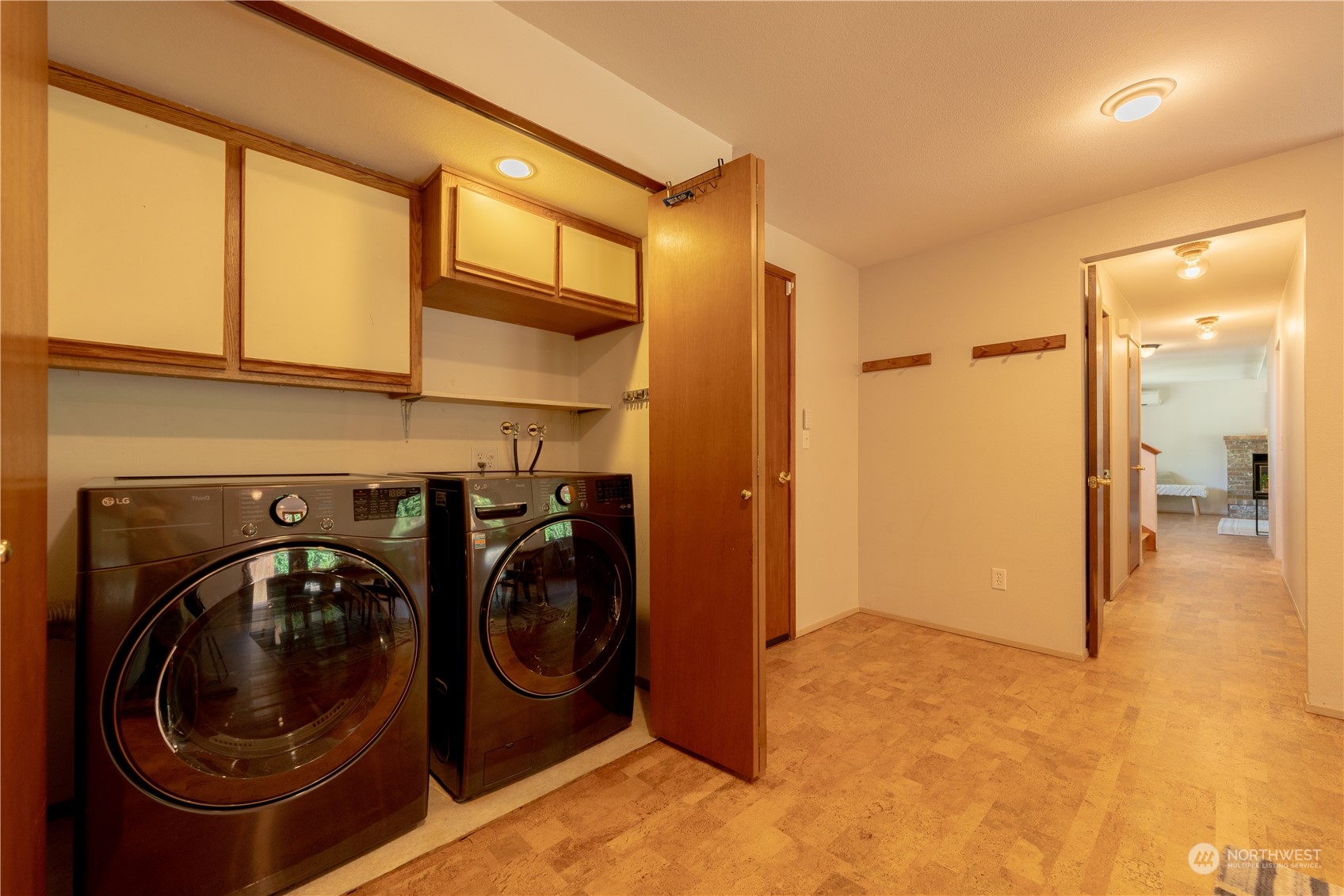 1213 228th Place Southwest Bothell, WA 98021 - Photo 13 of 40 a view of a storage & utility room with washer and dryer