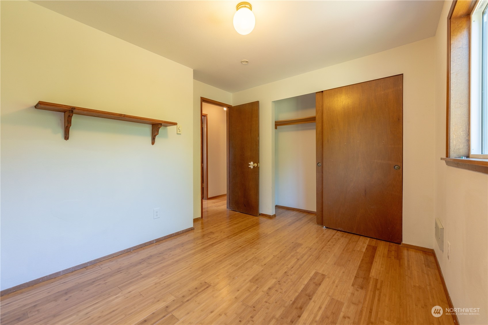 1213 228th Place Southwest Bothell, WA 98021 - Photo 26 of 40 a view of an empty room with wooden floor