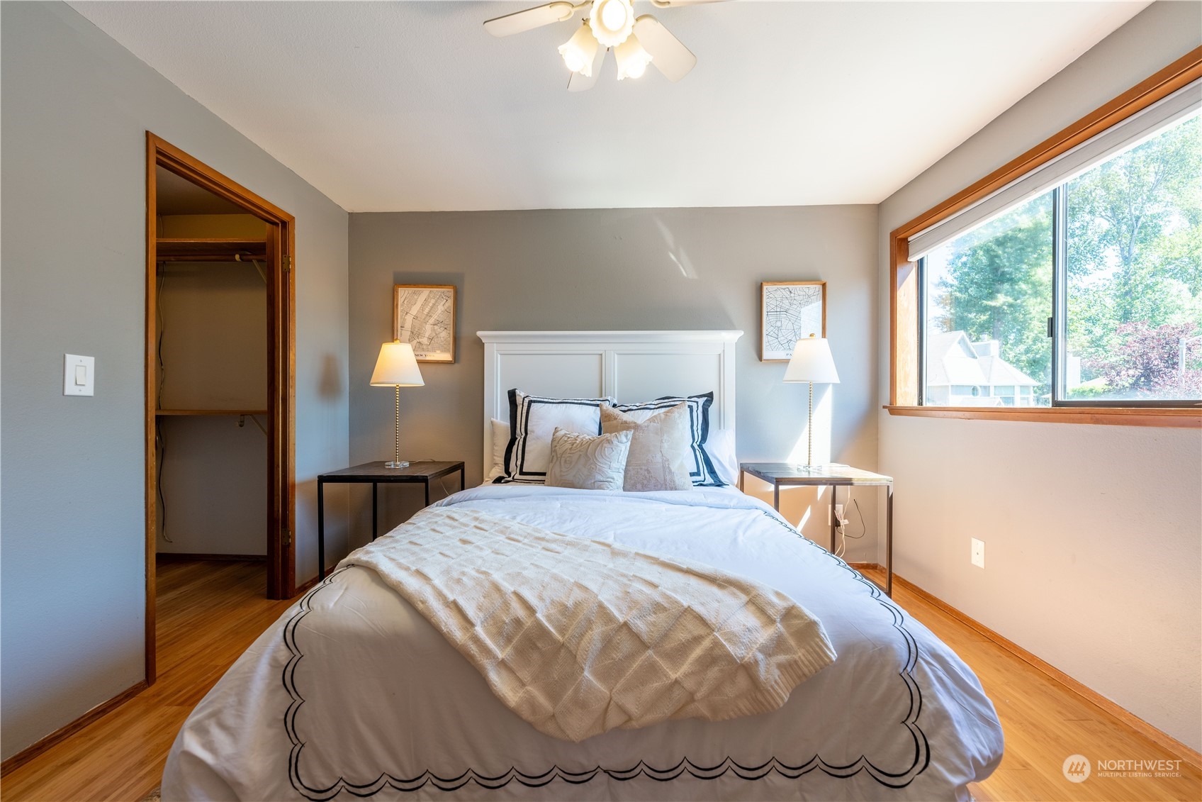 1213 228th Place Southwest Bothell, WA 98021 - Photo 28 of 40 a bedroom with a bed and a chandelier