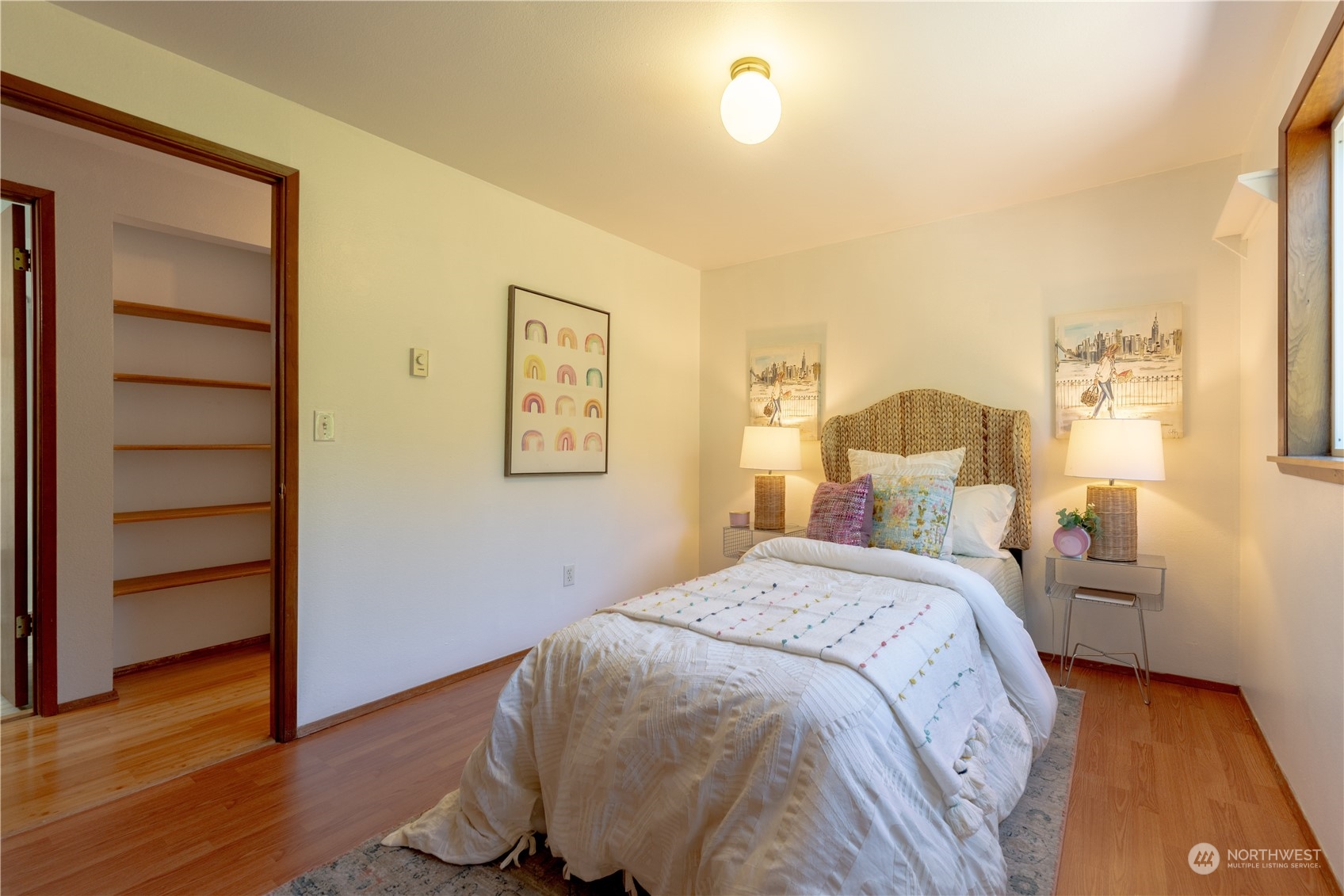 1213 228th Place Southwest Bothell, WA 98021 - Photo 5 of 40 a bedroom with a bed and wooden floor