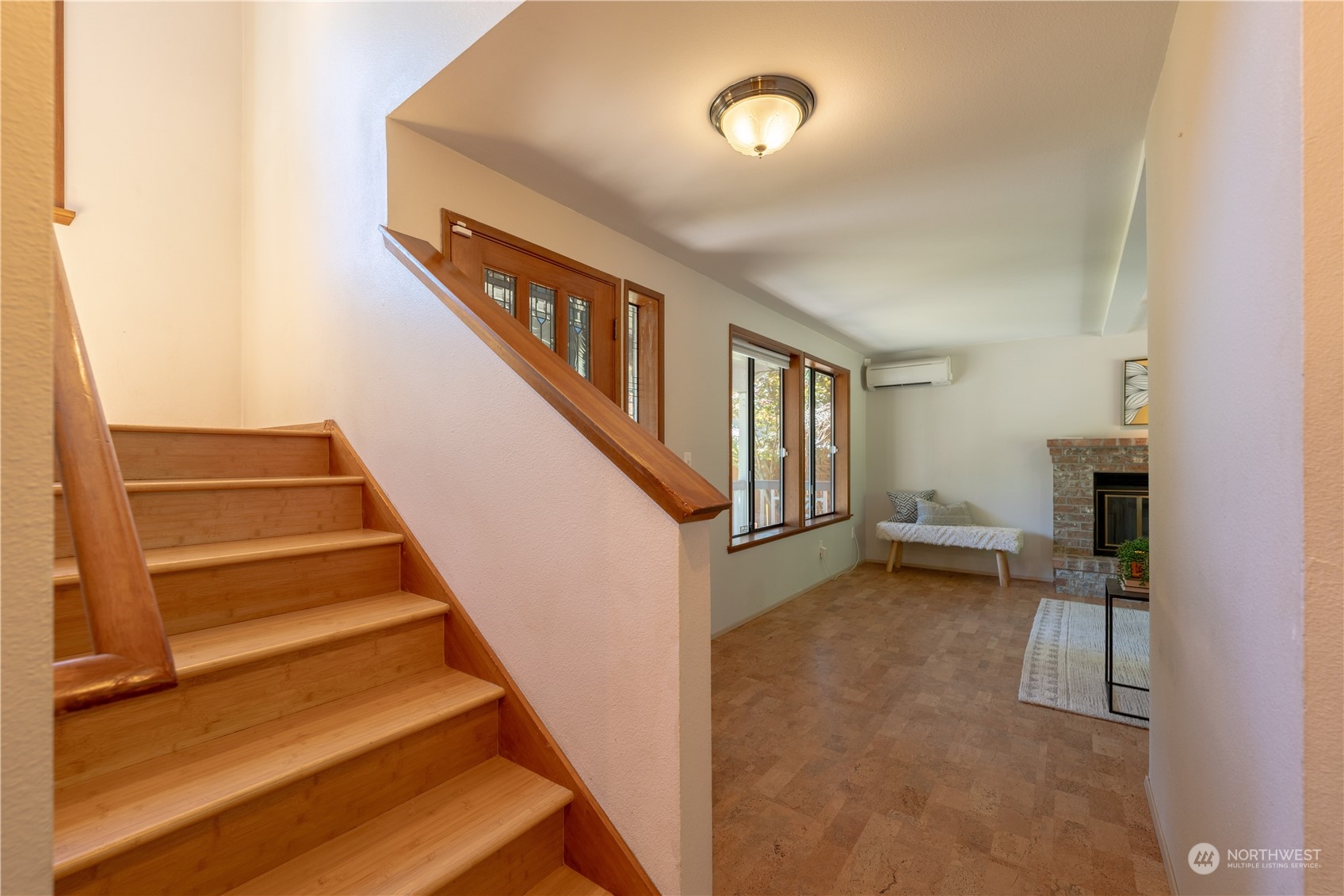 1213 228th Place Southwest Bothell, WA 98021 - Photo 6 of 40 a view of entryway and hall with wooden floor