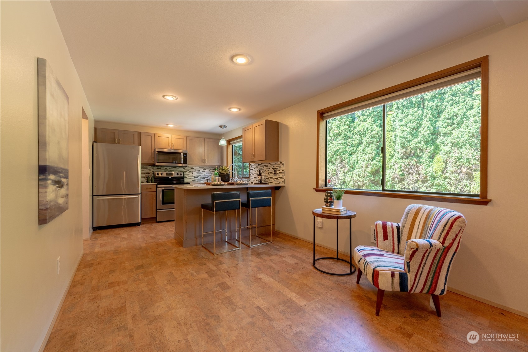 1213 228th Place Southwest Bothell, WA 98021 - Photo 10 of 40 a kitchen with a table chairs refrigerator and chairs
