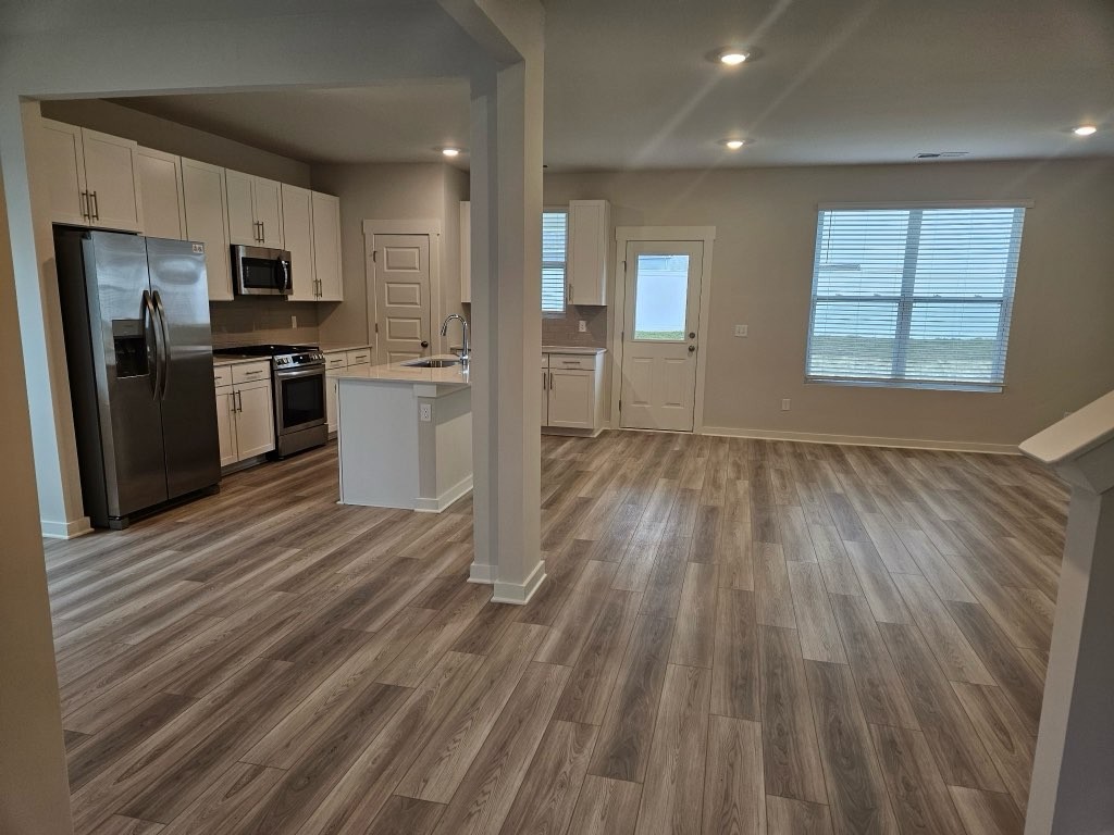 1311 Chambers Bay Drive, Unit LOT 802 Lebanon, TN 37087 - Photo 2 of 5 a view of kitchen view wooden floor and stainless steel appliances