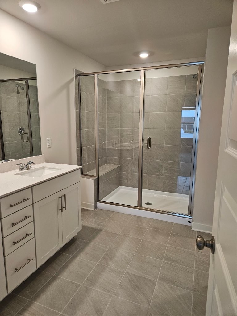 1311 Chambers Bay Drive, Unit LOT 802 Lebanon, TN 37087 - Photo 5 of 5 a bathroom with a shower sink and mirror