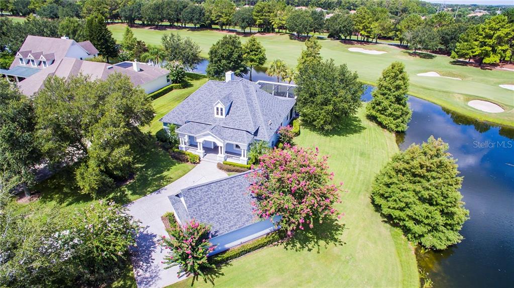 5902 Blakeford Drive Windermere, FL 34786 - Photo 1 of 1 an aerial view of a house with a garden and lake view