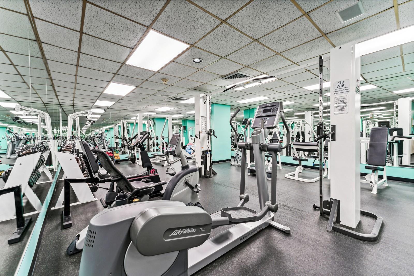 5255 Collins Avenue, Unit 11A Miami Beach, FL 33140 - Photo 13 of 15 a view of a room with gym equipment