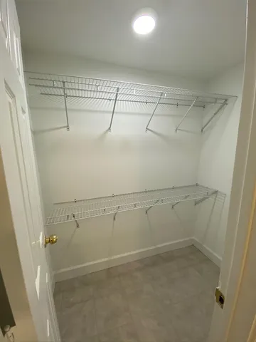 a view of a room with racks on the wall