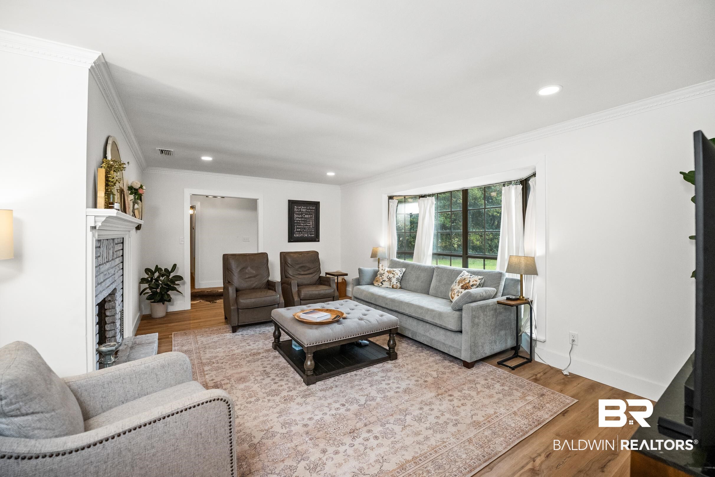 6 Wren Circle Foley, AL 36535 - Photo 8 of 55 Living room with ornamental molding, wood finished floors, recessed lighting, a fireplace, and baseboards
