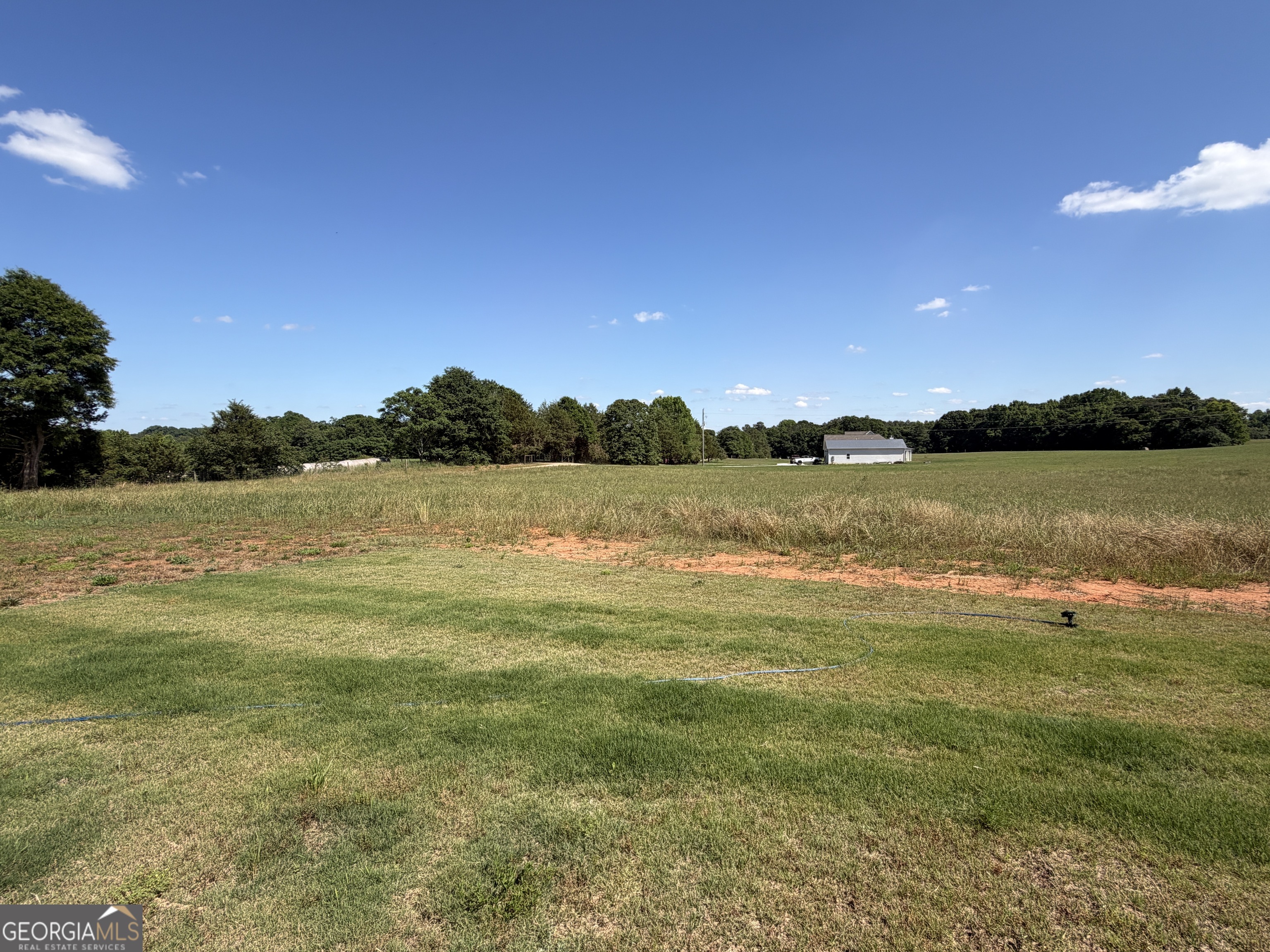 1350-c O Draper Road Comer, GA 30629 - Photo 10 of 47 a view of a lake with houses in the background