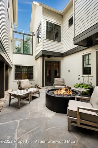 a outdoor living space with patio furniture and potted plants
