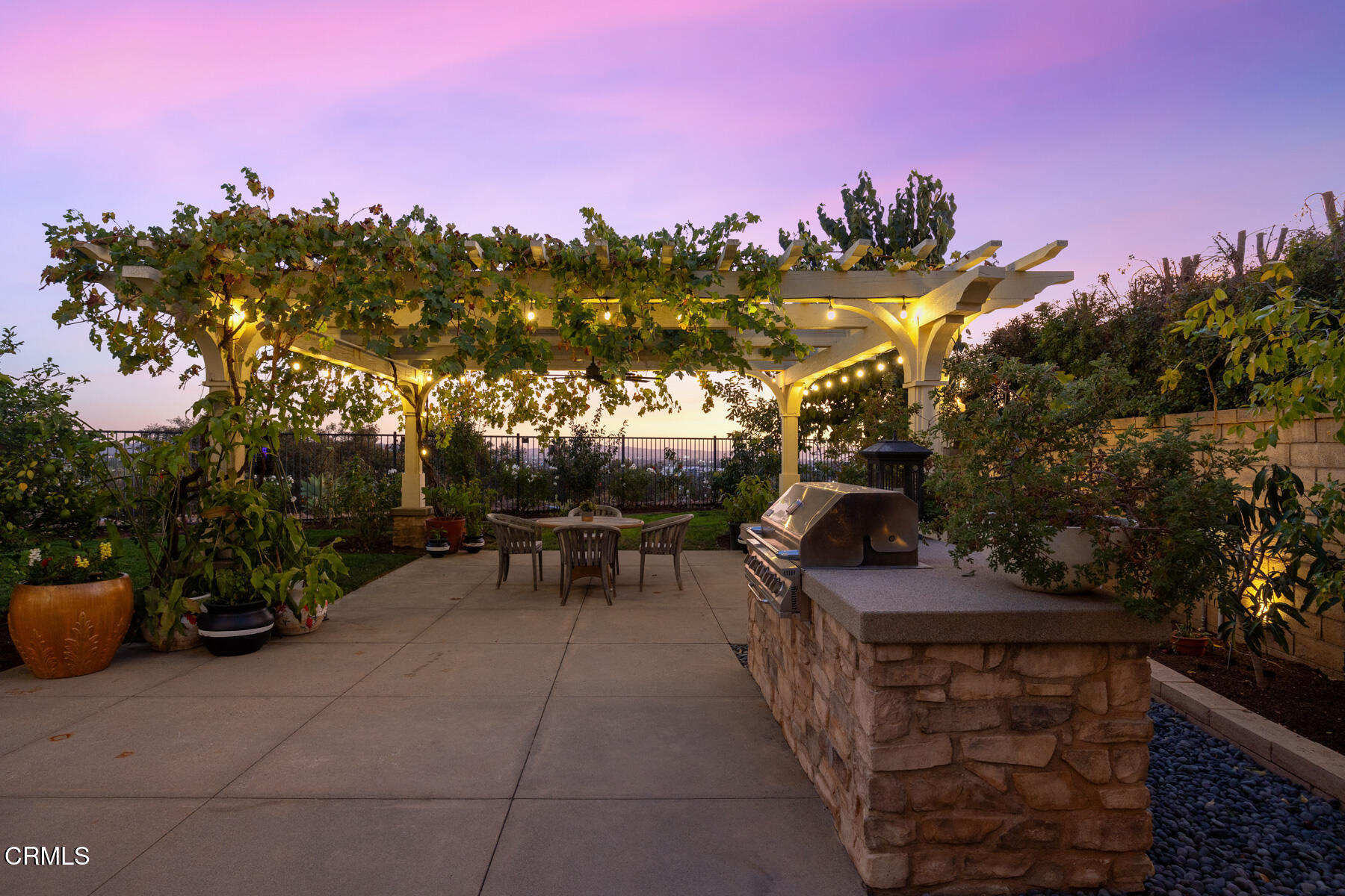 472 Desert Willow Road Azusa, CA 91702 - Photo 14 of 26 a view of a patio with dining table and chairs with a fire pit