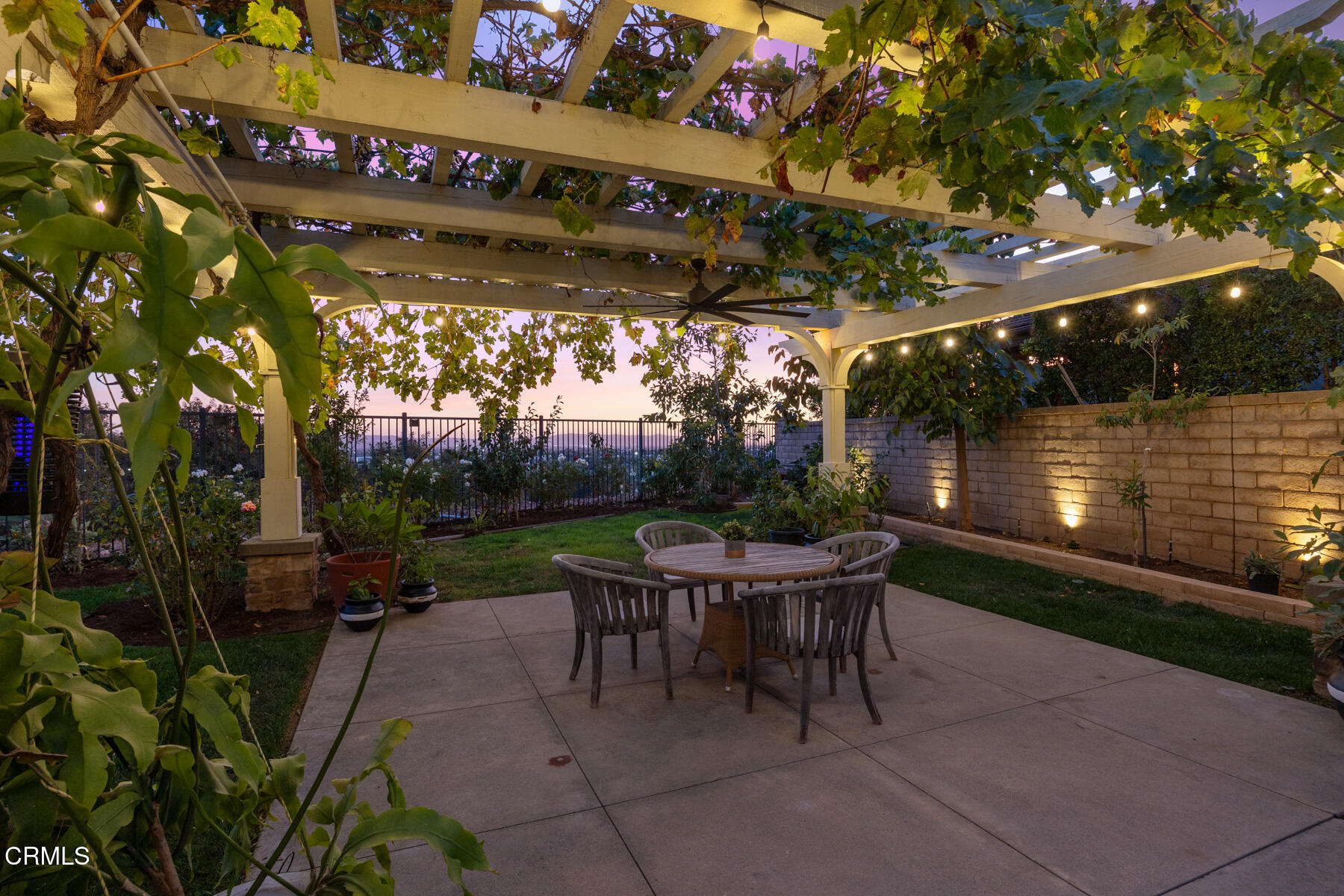 472 Desert Willow Road Azusa, CA 91702 - Photo 16 of 26 a patio with a table and chairs and potted plants