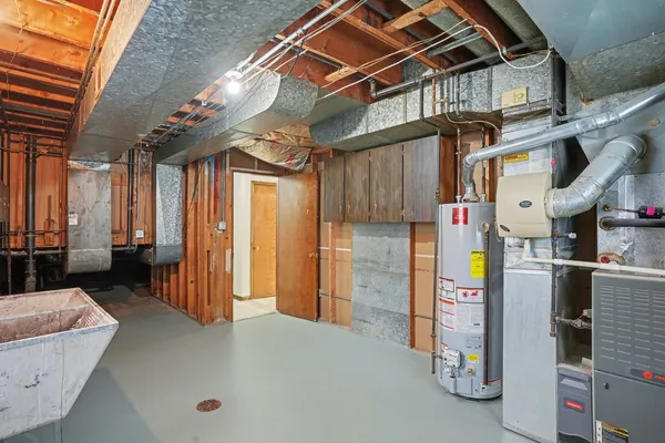 a kitchen with a sink cabinets and window