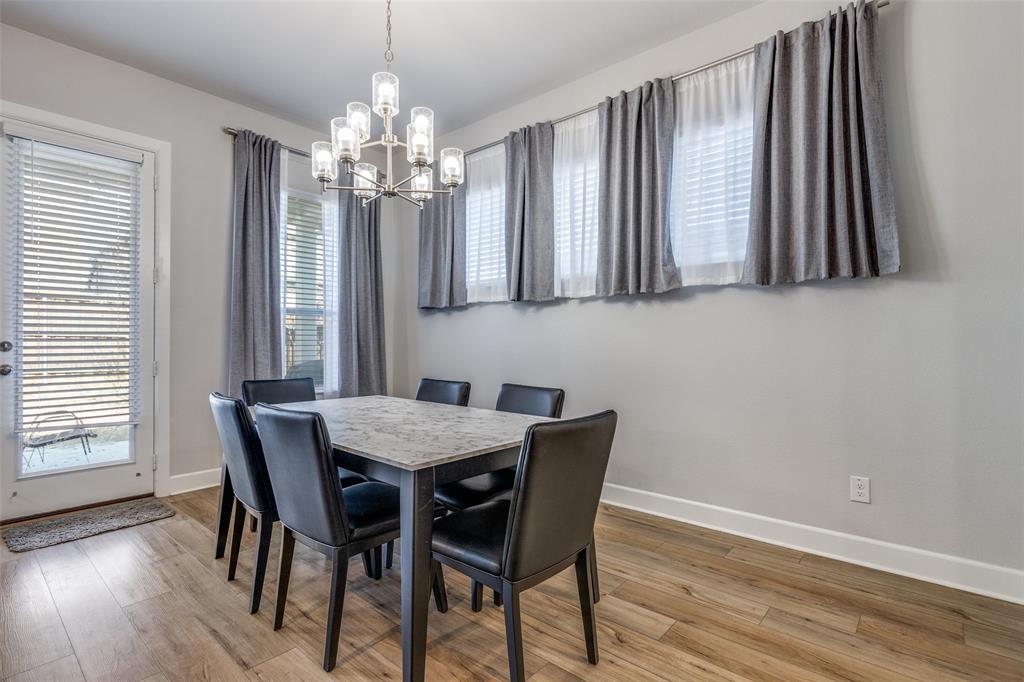 356 Greenbriar Road Little Elm, TX 75068 - Photo 13 of 25 Dining area with light wood-style flooring and hanging lights
