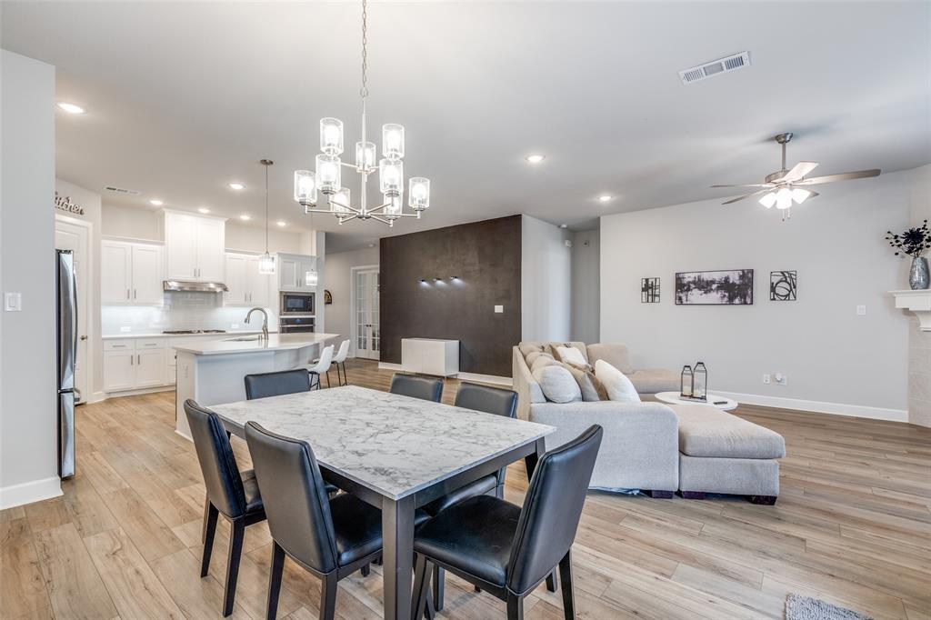 356 Greenbriar Road Little Elm, TX 75068 - Photo 14 of 25 Dining space with light wood-style floors, suspended lighting, and ceiling fan