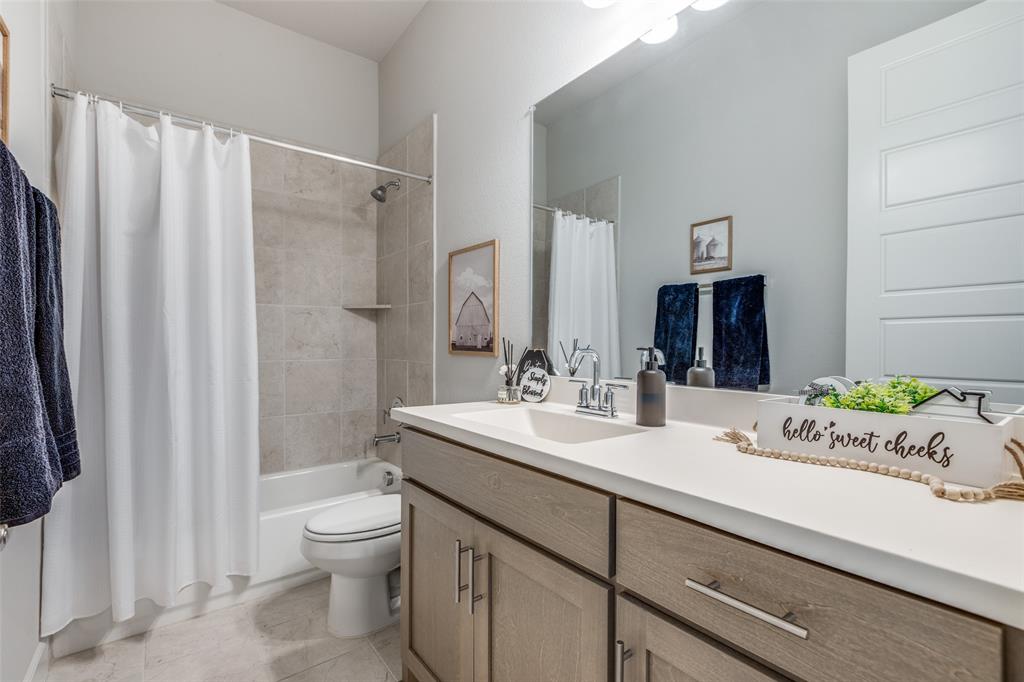 356 Greenbriar Road Little Elm, TX 75068 - Photo 20 of 25 Bathroom with vanity and shower / bath combo with shower curtain