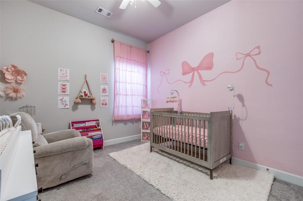 356 Greenbriar Road Little Elm, TX 75068 - Photo 6 of 25 Bedroom featuring a crib, carpet, and ceiling fan