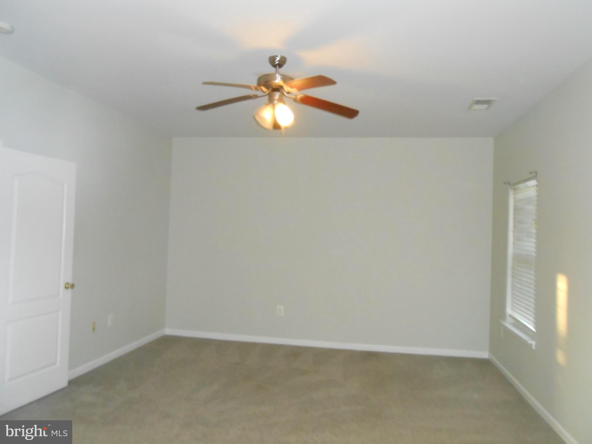 202 London Downs Circle Stephens City, VA 22655 - Photo 20 of 22 an empty room with windows and fan