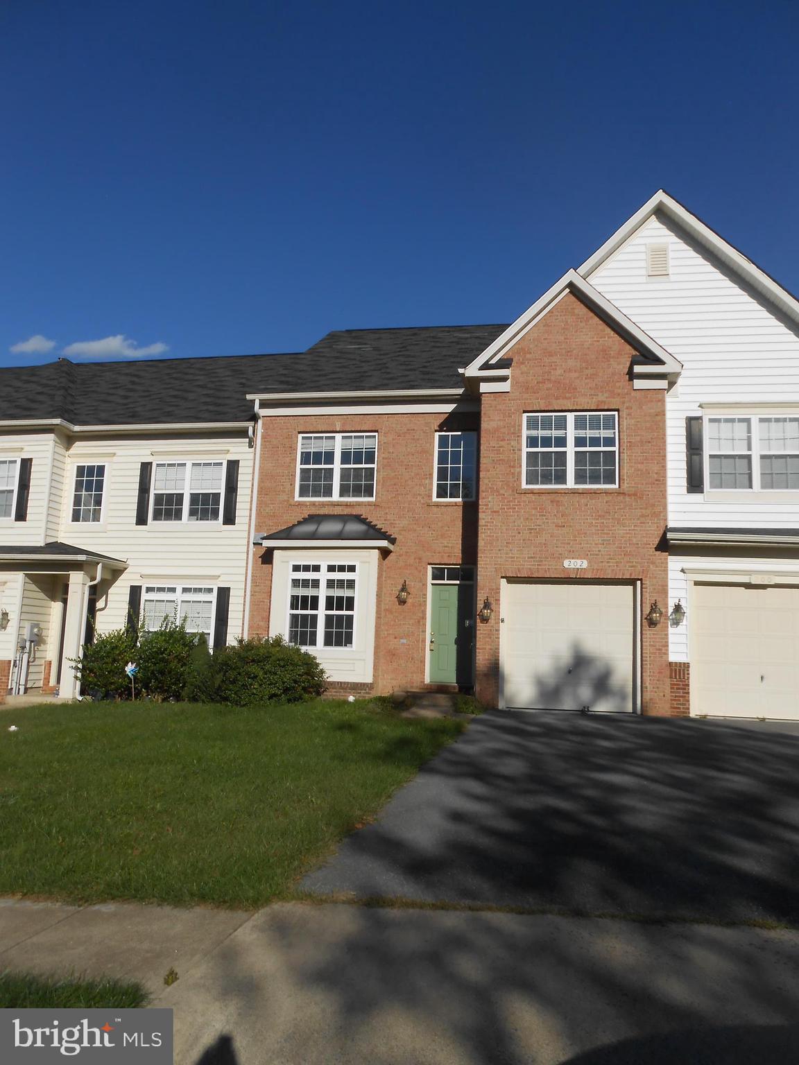 202 London Downs Circle Stephens City, VA 22655 - Photo 2 of 22 a front view of a house with a garden