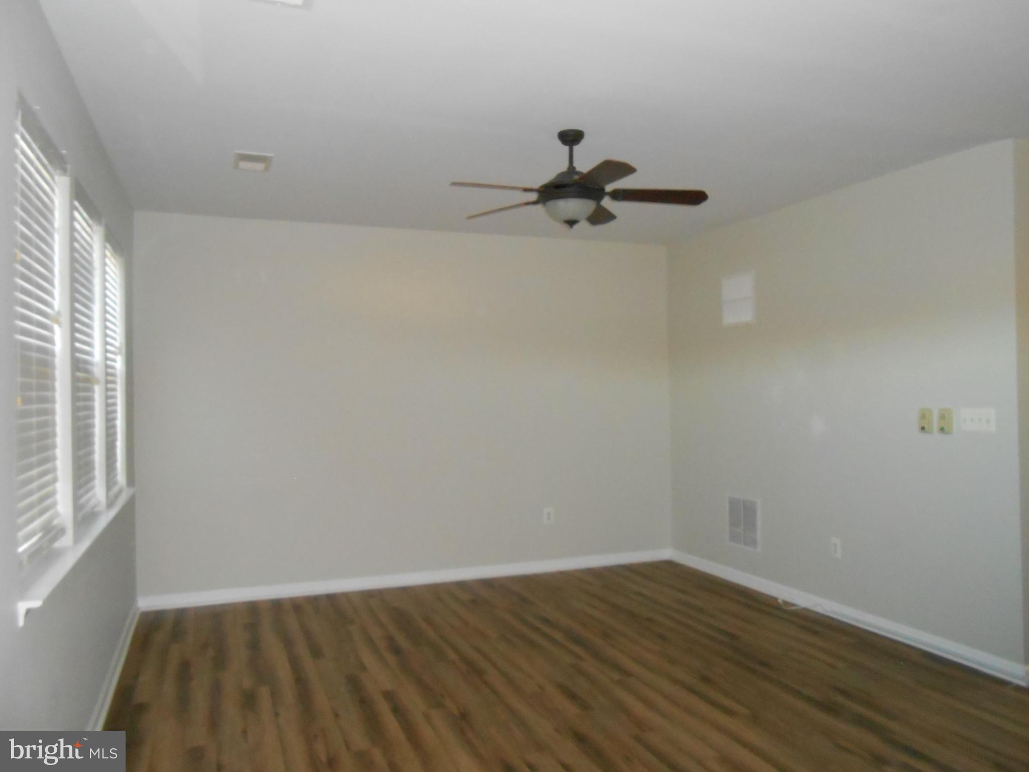 202 London Downs Circle Stephens City, VA 22655 - Photo 5 of 22 wooden floor in an empty room with a window
