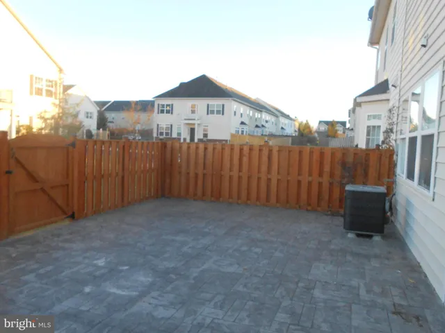 a view of a house with a fence
