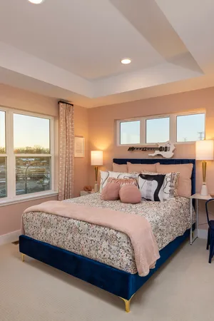 a bedroom with a large bed and a large window