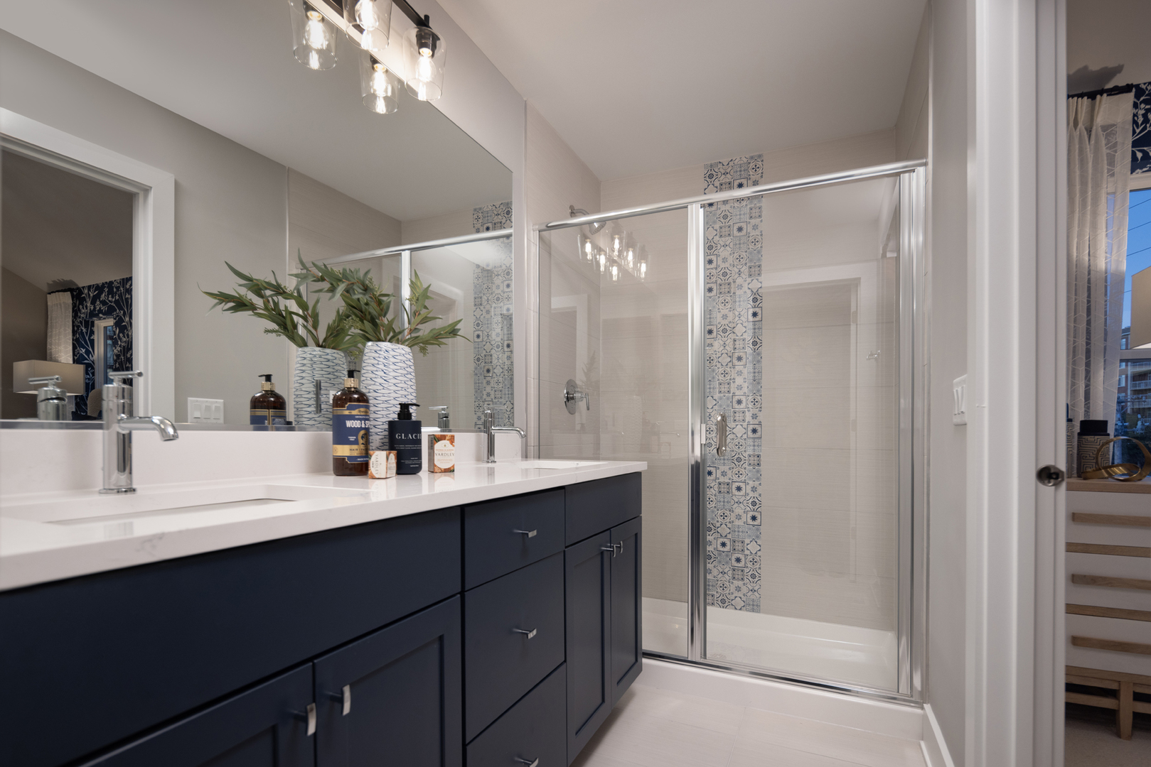 1181 Shermer Road Northbrook, IL 60062 - Photo 12 of 12 a bathroom with a double vanity sink mirror and shower