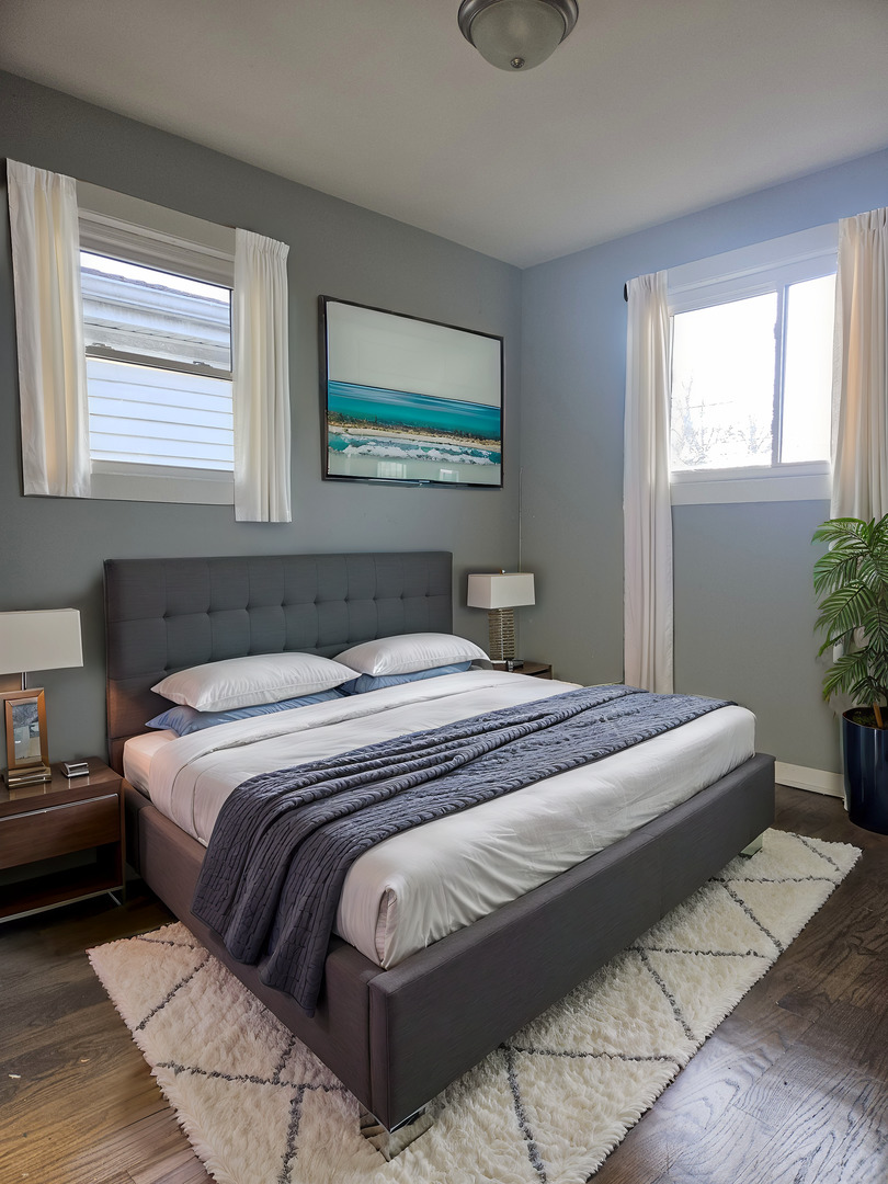 6732 South Peoria Street Chicago, IL 60621 - Photo 13 of 22 a bedroom with a bed and a window
