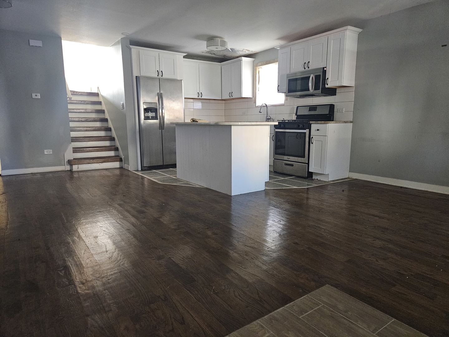 6732 South Peoria Street Chicago, IL 60621 - Photo 5 of 22 a kitchen with stainless steel appliances a stove top oven a sink and cabinets