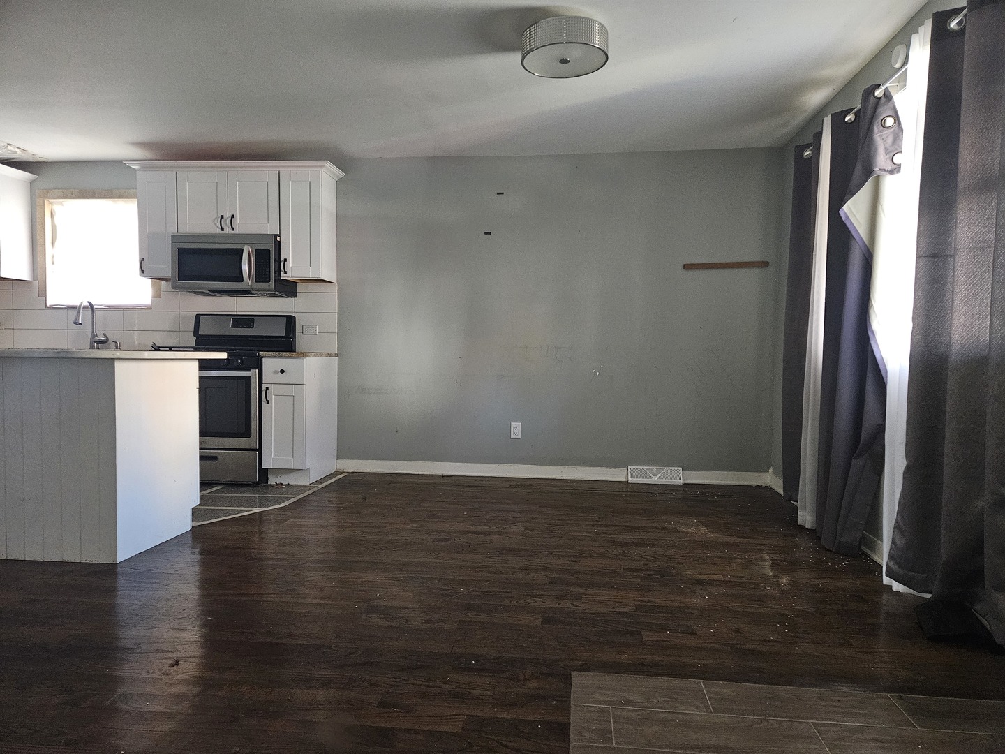 6732 South Peoria Street Chicago, IL 60621 - Photo 7 of 22 a view of kitchen with wooden floor electronic appliances and cabinets