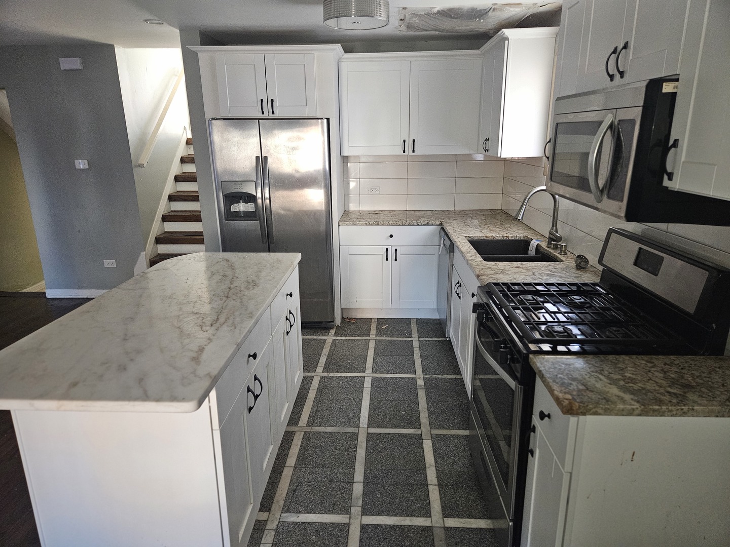 6732 South Peoria Street Chicago, IL 60621 - Photo 8 of 22 a kitchen with cabinets and steel stainless steel appliances