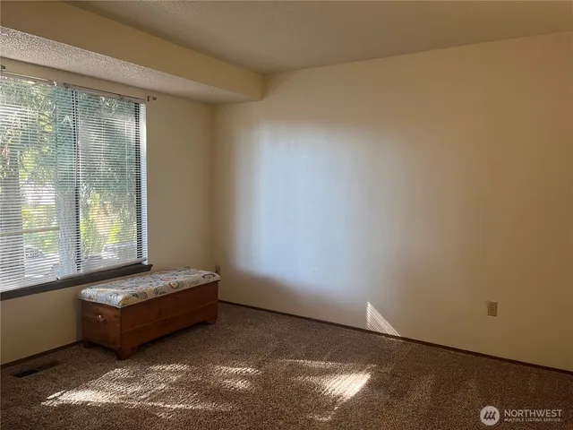a living room with couch and a window