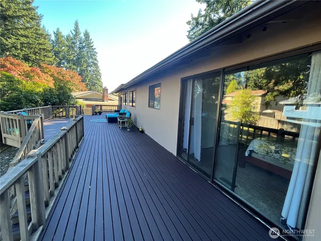 a view of deck with wooden floor and outdoor seating