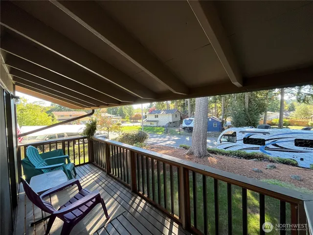 a view of a two chairs in the balcony