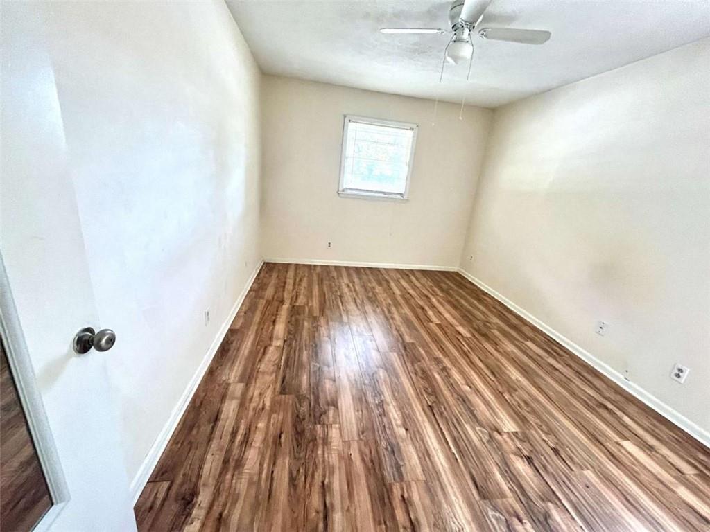 1002 Level Creek Road, Unit 201 Sugar Hill, GA 30518 - Photo 11 of 13 wooden floor in a hall with a window