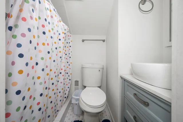 a bathroom with a toilet and a sink