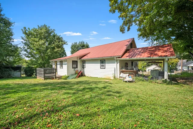 a view of a house with a yard porch and sitting area