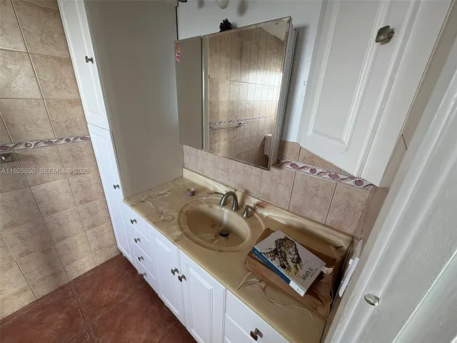 a view of a tall building with a yard