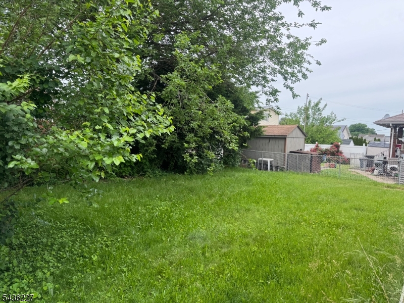 218 Bell Avenue Lodi, NJ 07644 - Photo 14 of 14 a view of a house with a backyard