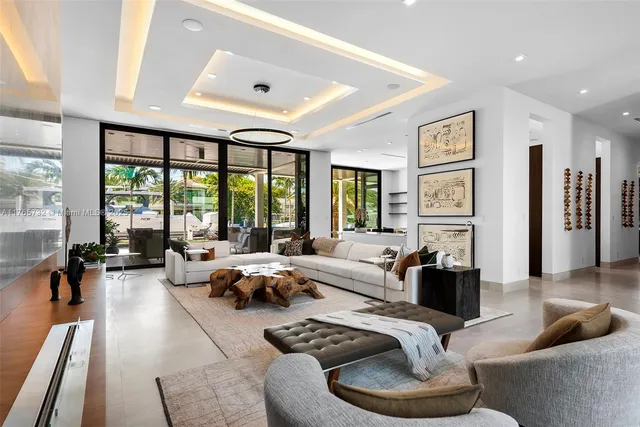 a room with pool table view and flat screen tv