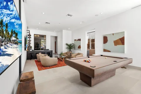 a bed room with furniture and a large window