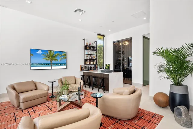 a bedroom with a large bed and a large window