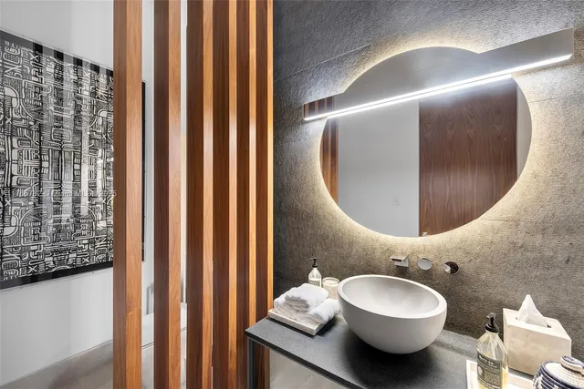 a bedroom with a large bed and a large window