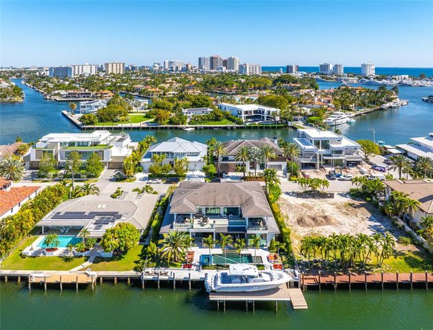 a living room with furniture large window and flat screen tv