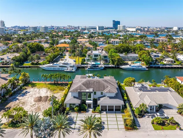 a view of a swimming pool with a table and chairs