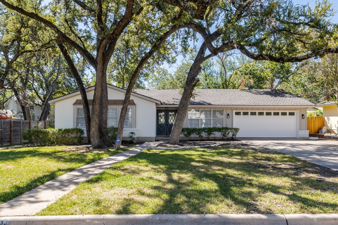 4103 Deepwoods Drive Austin, TX 78731 - Photo 1 of 1 a view of a house with a yard and large tree
