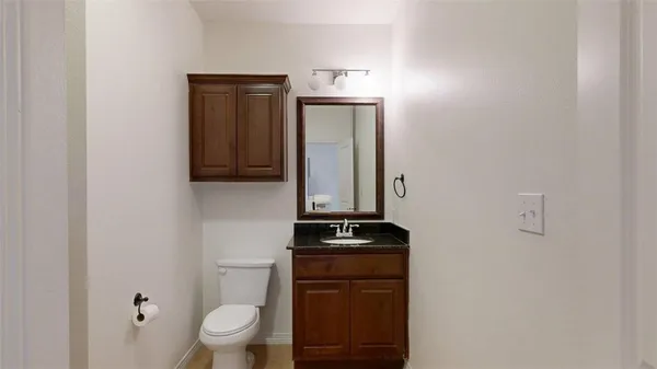 a bathroom with a toilet and a sink