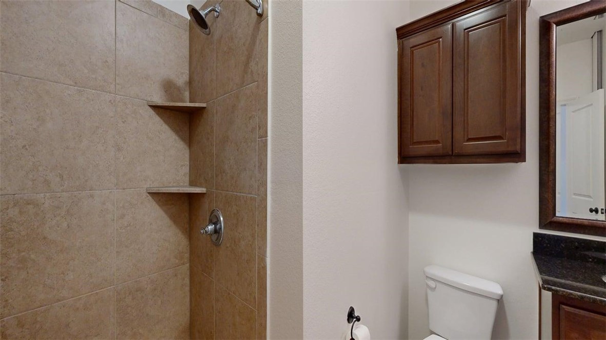 206 North Main Street, Unit 124 Bryan, TX 77803 - Photo 14 of 17 a bathroom with a sink and toilet