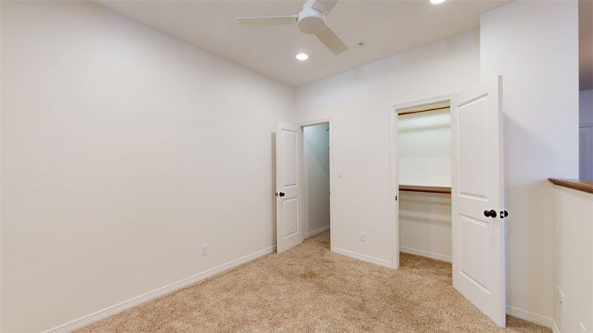 206 North Main Street, Unit 124 Bryan, TX 77803 - Photo 10 of 17 an empty room with closet and a hallway